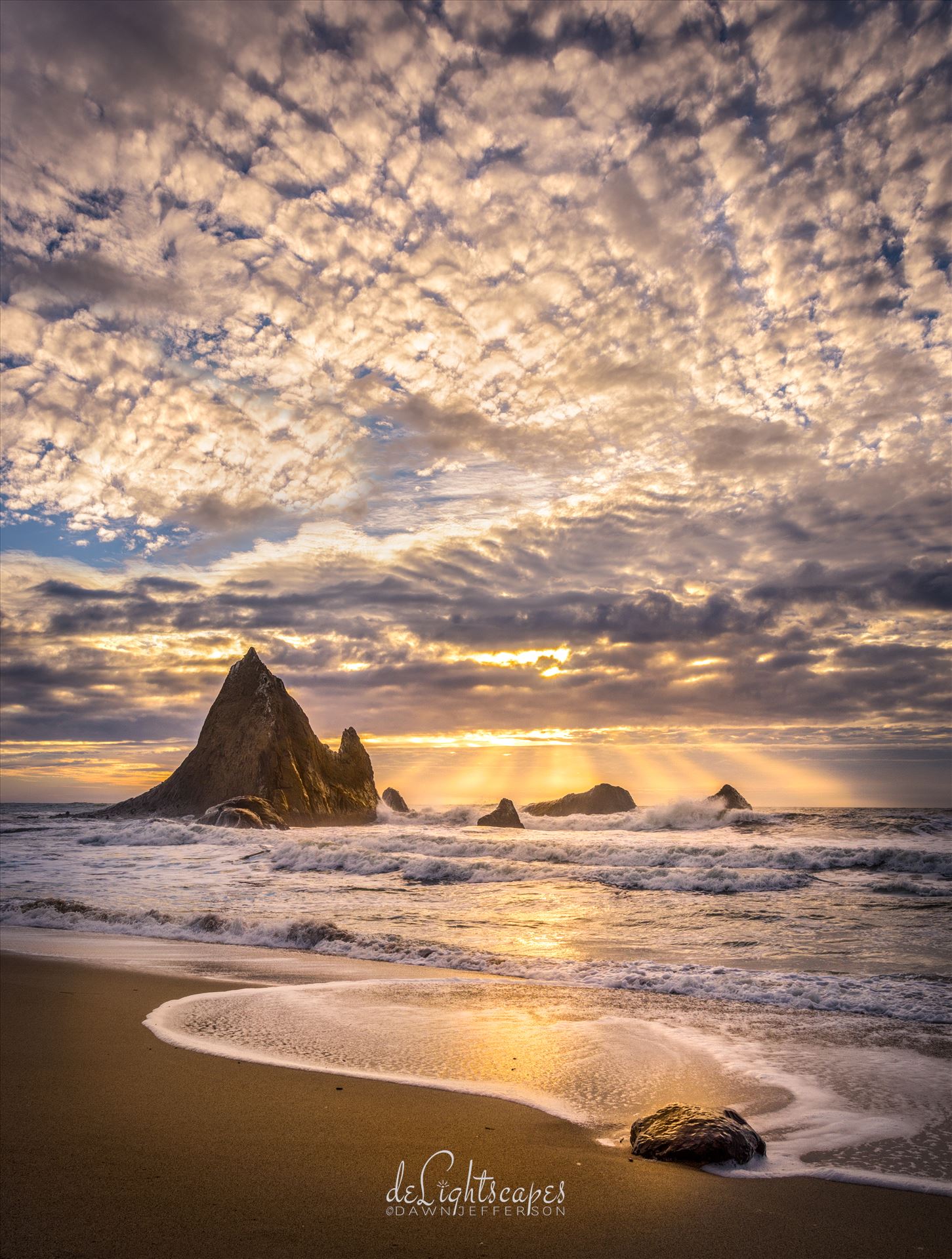 God Beams Before Sunset - Sun rays glisten through an opening in the clouds. by Dawn Jefferson