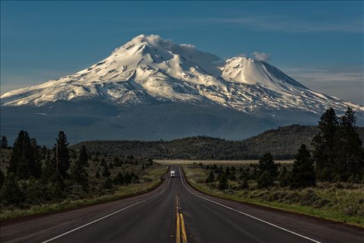 Caution: Volcano Ahead - Mt Shasta is the 5th highest peak in California. It rises abruptly to 14,179 ft. Most prominently seen are the main summit and the satellite cone known as Shastina.